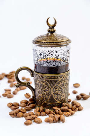 Vintage coffee cup and coffee beans on white backgroundの写真素材