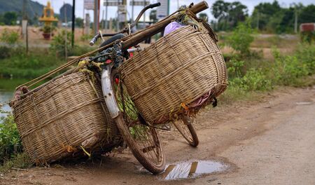 All around Asia you will find bicycles overloaded with too much cargo and just simple baskets の写真素材