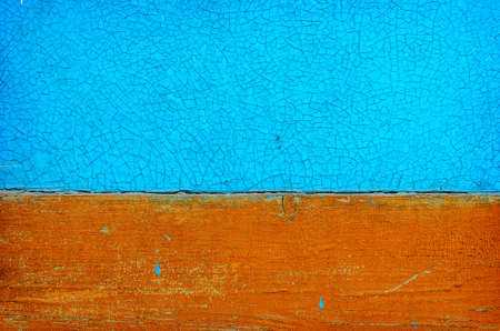 Blue and orange grunge wood close-up background. Painted old wooden wall.の写真素材