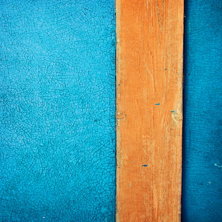 Blue and orange grunge wood close-up background. Painted old wooden wall.の写真素材