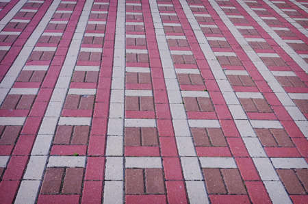 The texture of perspective colored checkered tile in the street