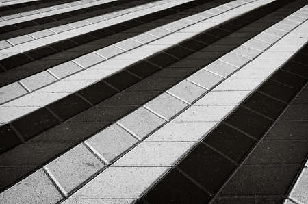 Black and white texture of perspective colored checkered tile in the streetの写真素材