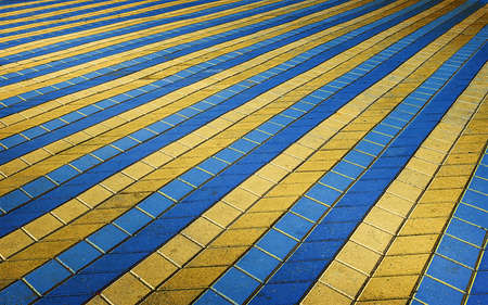 The colored texture of perspective colored checkered tile in the street