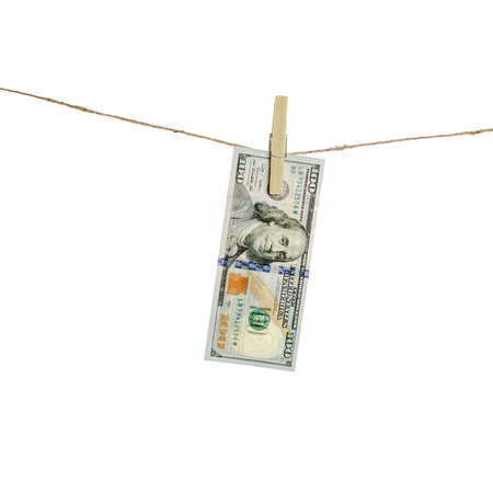 Dollars hang on clothes-rope isolated on white
