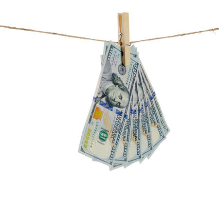 Dollars hang on clothes-rope isolated on white