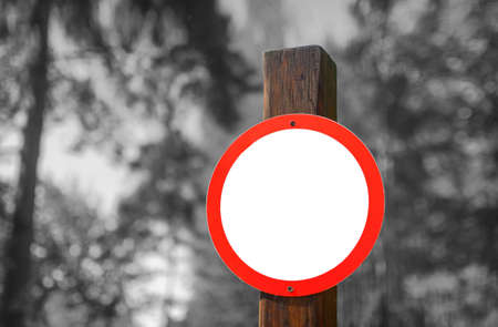 Red road sign circular shape on a background of summer forest. Black and whie toneの写真素材