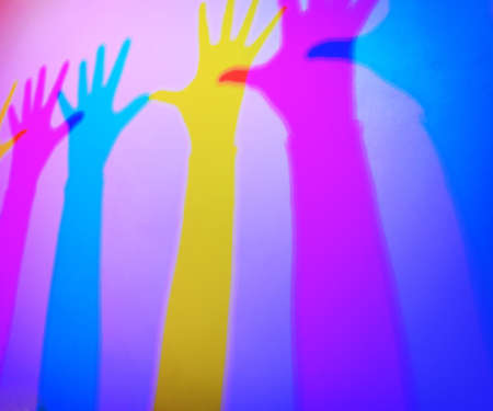 Colored silhouette shadow of handsの写真素材