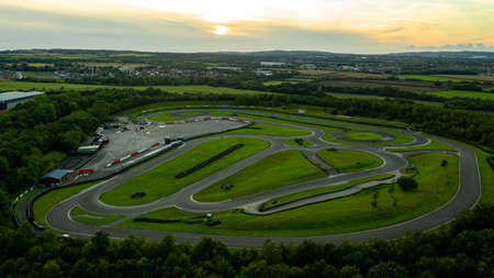 Aerial drone view of a go kart car race track circuit at sunsetの写真素材