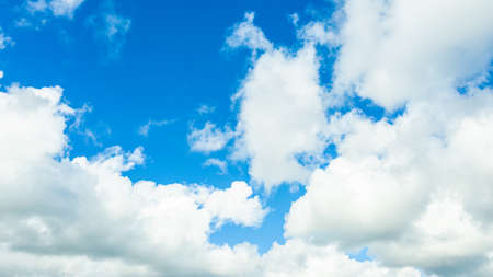Blue azure sky with white clouds. Clearing day and good weatherの写真素材