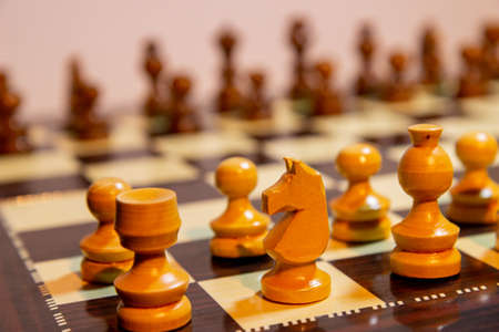 Wooden chess pieces on a chess Board