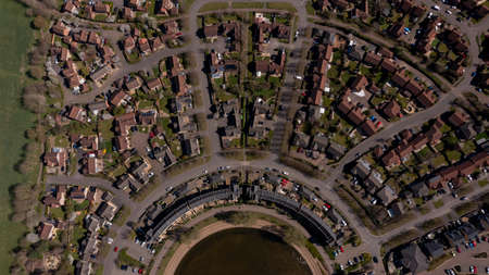 Aerial photo of the village of Caldecotte in Milton Keynes UK showing a typical British housing estate on a sunny summers day taken with a drone from aboveの写真素材