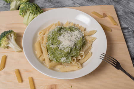 vegetarian low-calorie italian pasta with cabbage and grated cheese