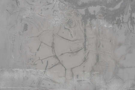 Wall texture many layers of paint with cracks hard shadows street lightingの写真素材