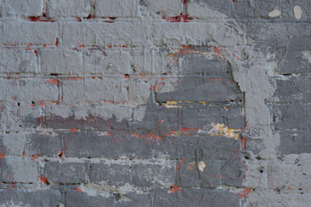 Wall texture many layers of paint with cracks hard shadows street lightingの写真素材