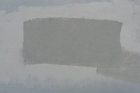 Decorative stucco background with textured sand with rough ragged edges gray white dirty colorの写真素材