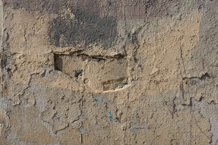 Wall texture many layers of paint with cracks hard shadows street lightingの写真素材