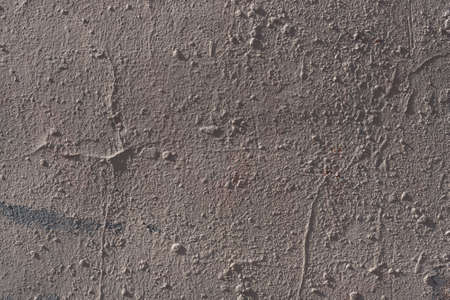 Decorative stucco background with textured sand with rough ragged edges gray white dirty colorの写真素材