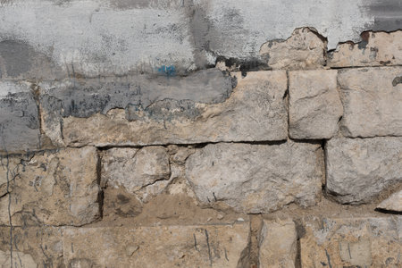 Decorative stucco background with textured sand with rough ragged edges gray white dirty colorの写真素材