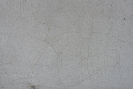 Decorative stucco background with textured sand with rough ragged edges gray white dirty colorの写真素材