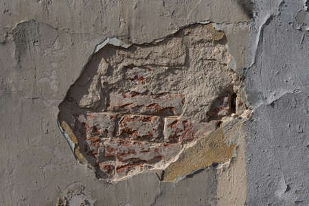 Decorative stucco background with textured sand with rough ragged edges gray white dirty colorの写真素材
