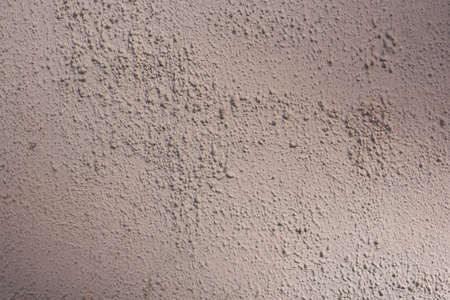 Decorative stucco background with textured sand with rough ragged edges gray white dirty colorの写真素材