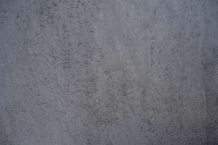 Construction plaster background with rough ragged edges gray white dirty colorの写真素材