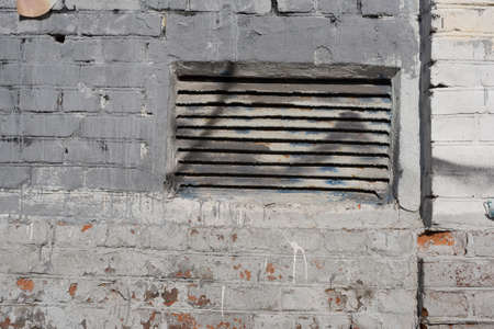 Construction plaster background with rough ragged edges gray white dirty colorの写真素材