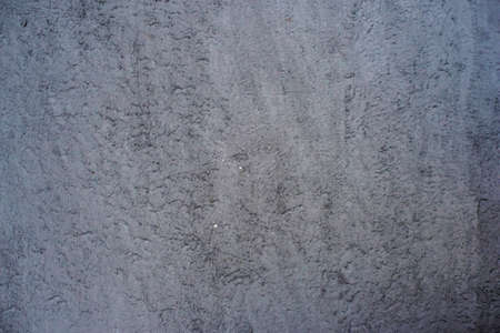 Construction plaster background with rough ragged edges gray white dirty colorの写真素材