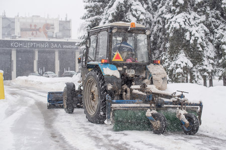 Moscow / Russia - Febuary 13, 2019: Snow blower cleans the streets during heavy snowのeditorial素材