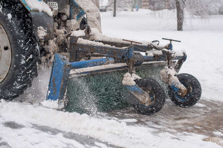 Moscow / Russia - Febuary 13, 2019: Snow blower cleans the streets during heavy snowのeditorial素材