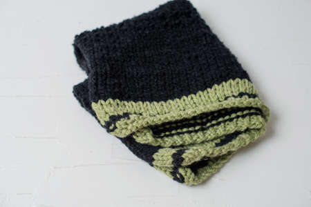 Beige knitted handmade blanket over white background home comfortの写真素材