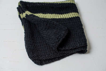 Beige knitted handmade blanket over white background home comfortの写真素材