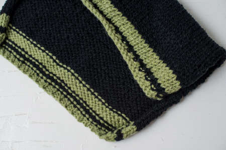 Beige knitted handmade blanket over white background home comfortの写真素材