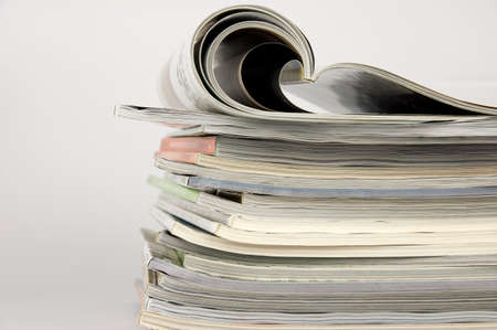 Pile of magazines over white backgroundの写真素材