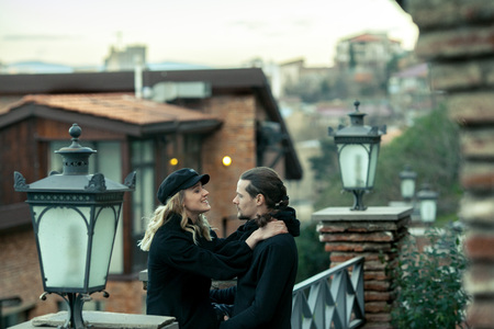 Young couple in love, kissing in the old part of town