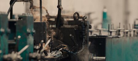 Industrial steel roll coil for metal profile forming machine in metalwork factory workshop. Concept for metalwork production. Close up.の写真素材