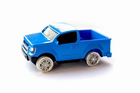 Children's toy little blue car on a white background.の写真素材