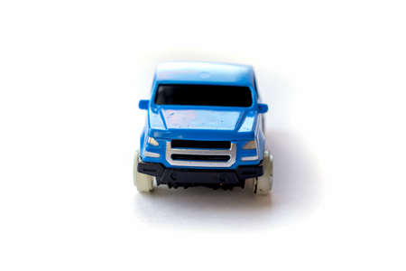 Children's toy little blue car on a white background.