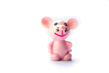 Isolated toy miniature pink mouse smiling on white background space for textの写真素材