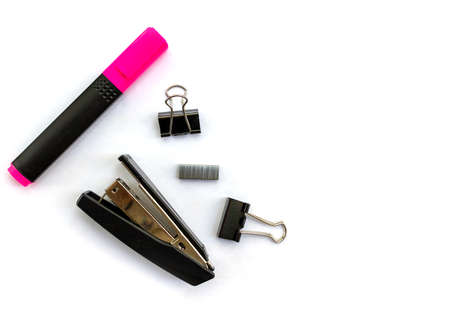 Isolated items stationery stapler staples clamps pink marker on white background top view space for...
