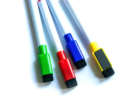 Multicolored markers on white background isolated items top view.の写真素材