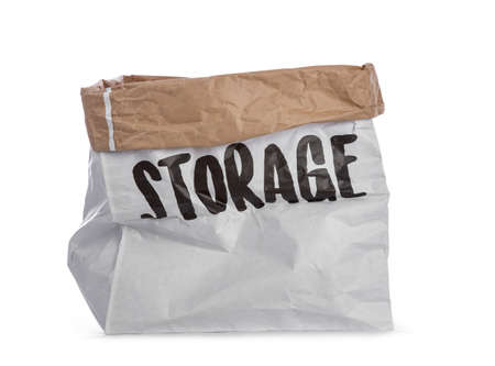 Empty big paper bag with storage written on the side. Isolated on a white background.