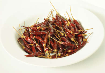 dry paprika on white background
