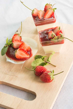 panacotta with fresh strawberry on wood dishの写真素材