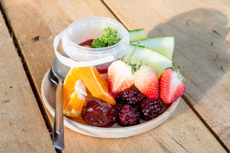 pana cotta with mix fruit on wood backgroundの写真素材