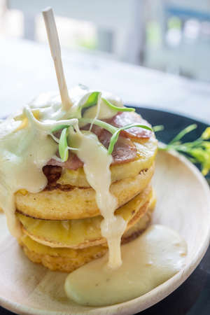 Pancake cheese ham on wood dishの写真素材