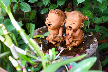 Doll potters in the gardenの写真素材