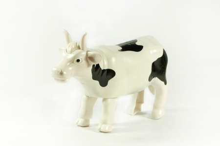 Plastic cow on a white backgroundの写真素材