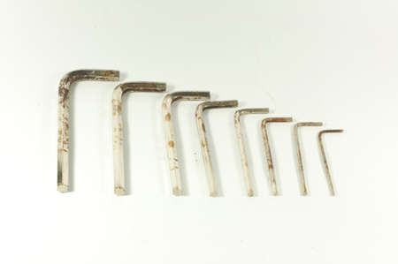 Old hex wrench in a white background .の写真素材