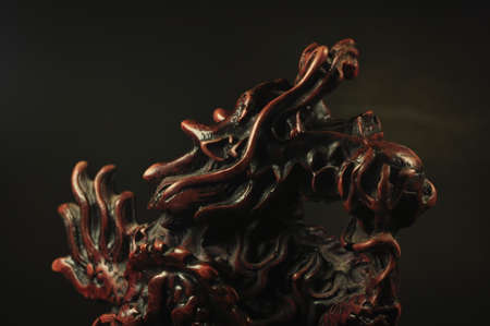 Dragon incense burner on a black backgroundの写真素材